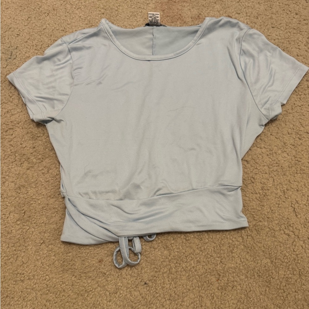 size m open back blue top